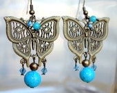 Filigree Butterflies Earrings  with intricate antiqued bronze filigree, turquoise blue howlite beads, and sparkly swarovski crystals
