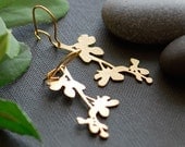 Magnolia branch earrings in gold