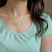A girl who loves orchids . Gold filled chain