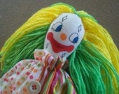 Sweet clown doll with green and yellow hair