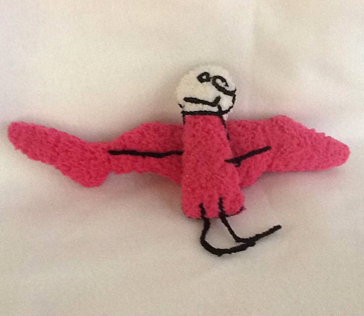 Plush pink angel creature designed by a 3 year old