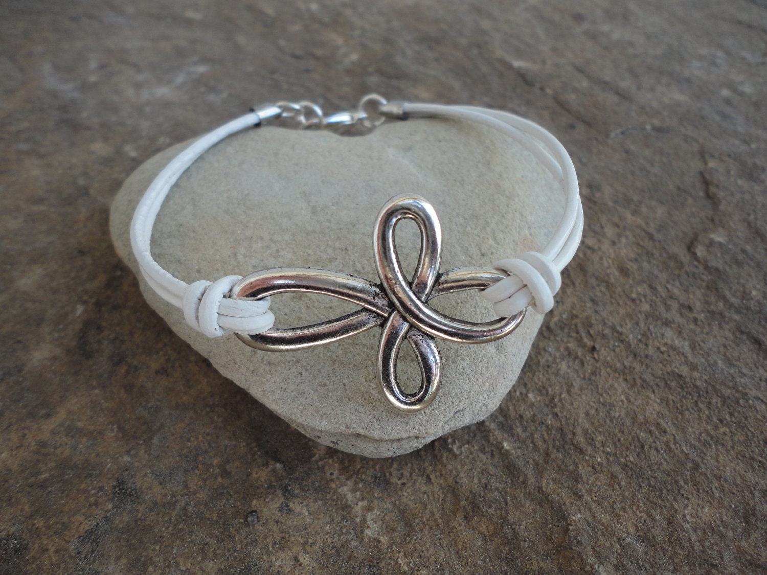 Santa Croce Pewter Cross White Leather Bracelet    16.99   SALE  14.99