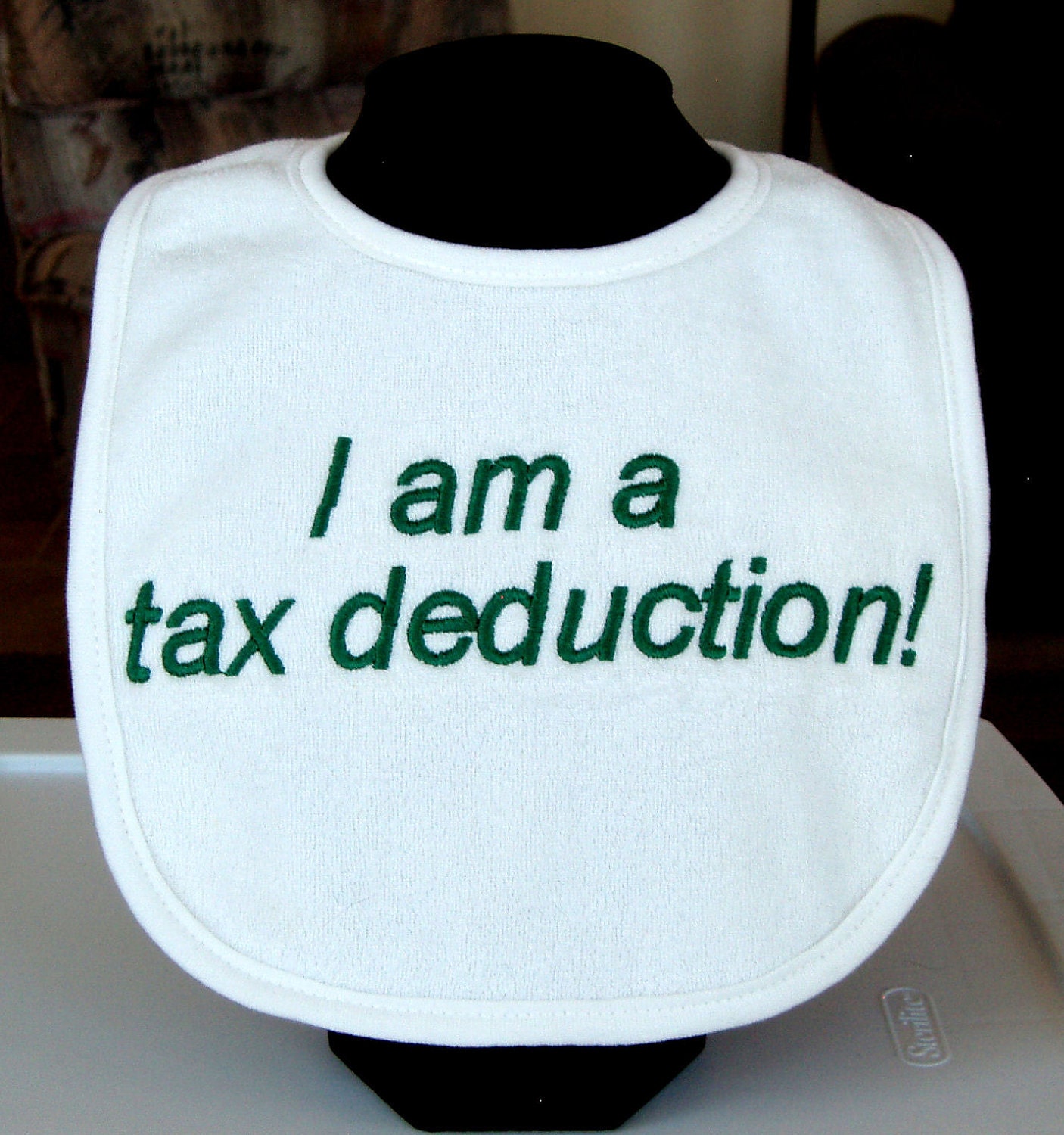 Tax Deduction Baby Bib in green