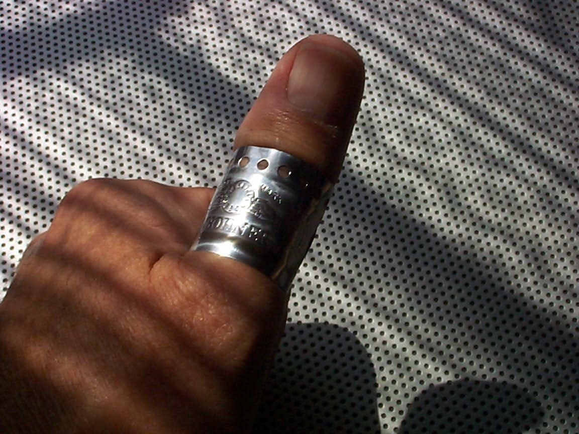 Music Fest Thumb Ring repurposed from harmonica plate