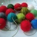 Holly Jolly Garland - a strand of red and holiday colors - about 6 feet long - 15 felt balls