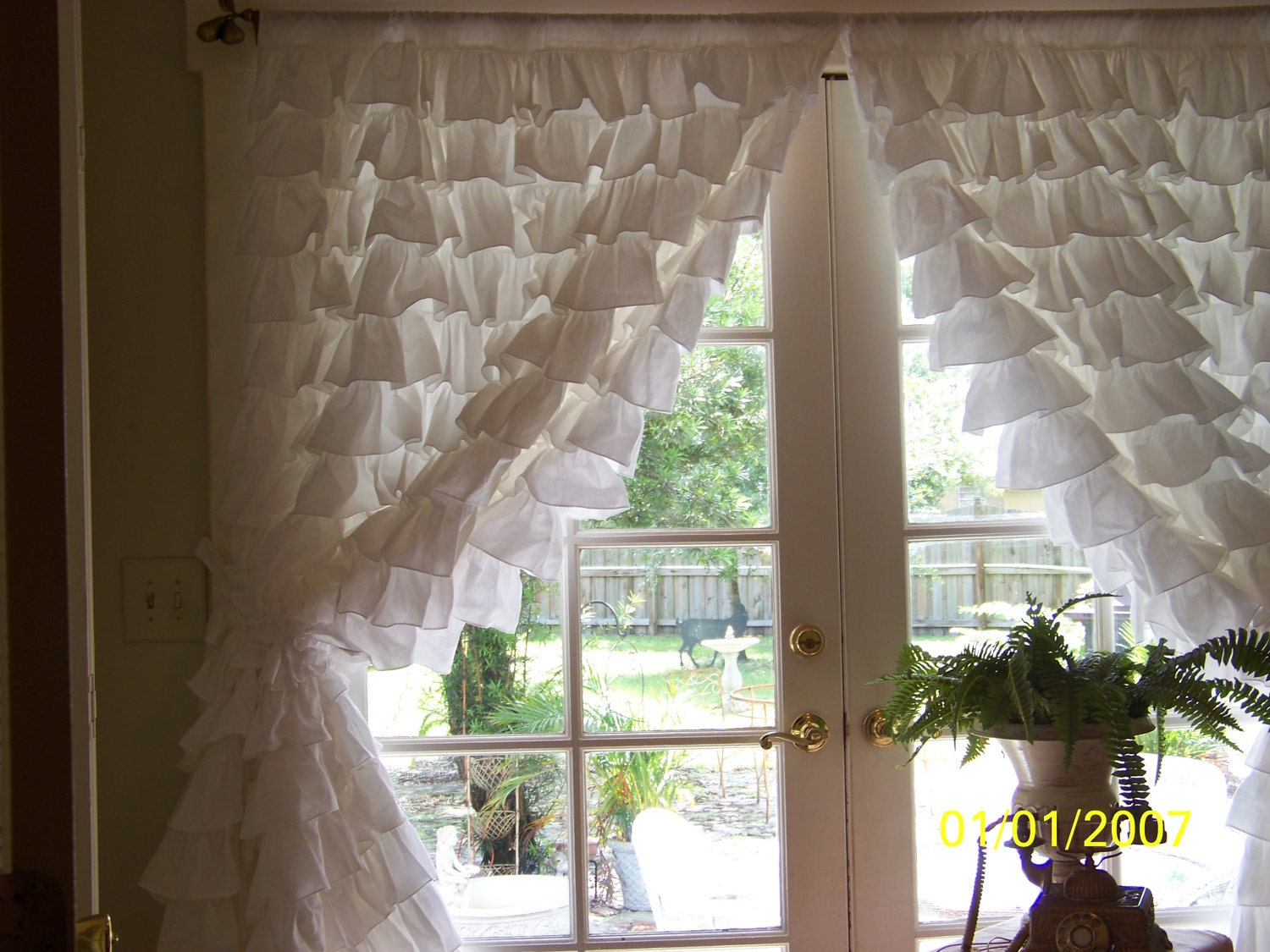 pair of romantic snow white ruffled curtains