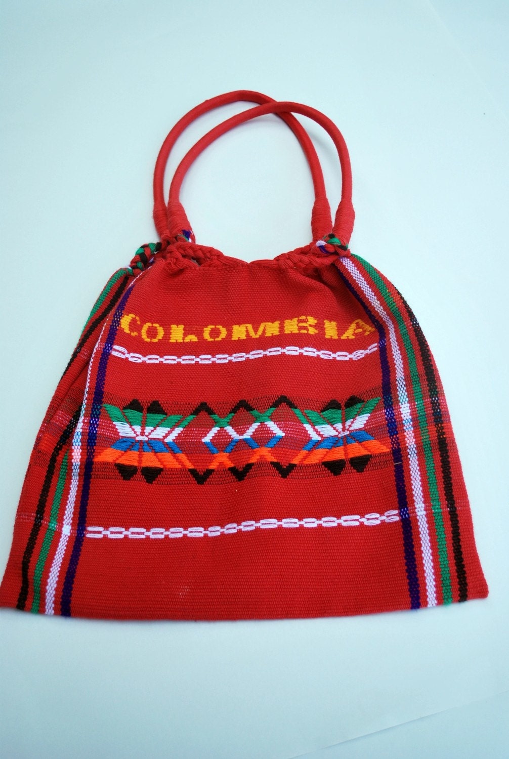 Bright red and colorful vintage woven cotton purse .hard structured straps .Braided .embroidered .Colombia