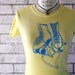 Skate Love roller skate ladies tee shirt with shoestring heart in yellow and aqua or custom colors