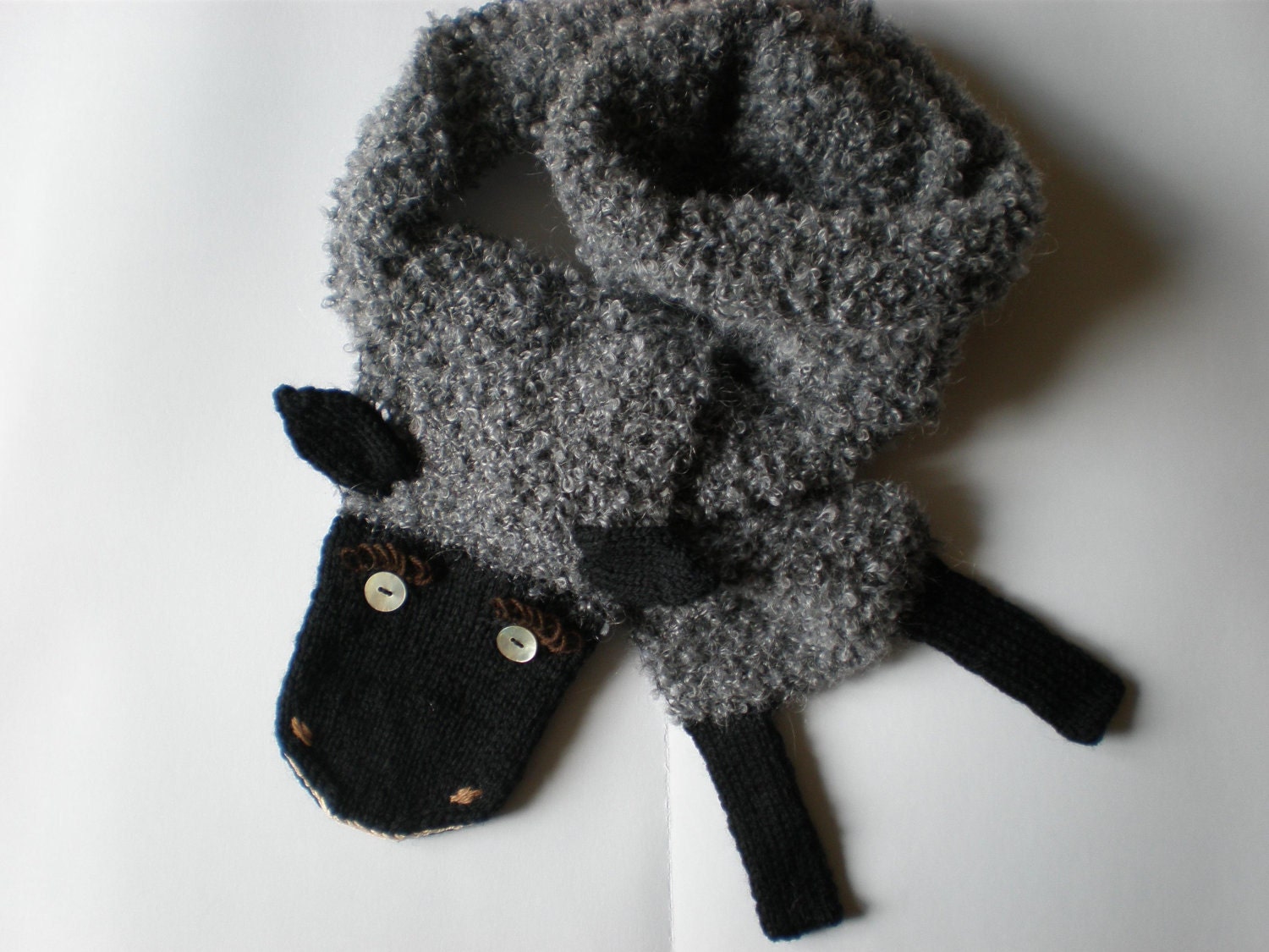 Hand-knitted grey black sheep scarf