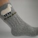 Hand-knitted light grey women socks with hand needlecrafted furry sheep