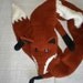 Hand-knitted reddish brown fox scarf