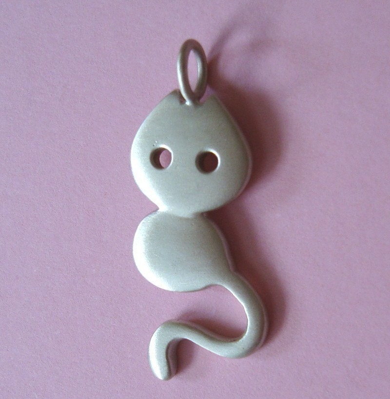 Little cat with leather cord