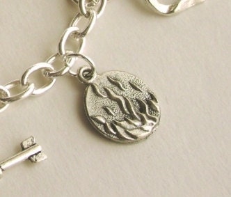 hunger games inspired fire charm