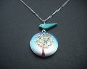 matte silver flower tree locket with turquoise bird necklace