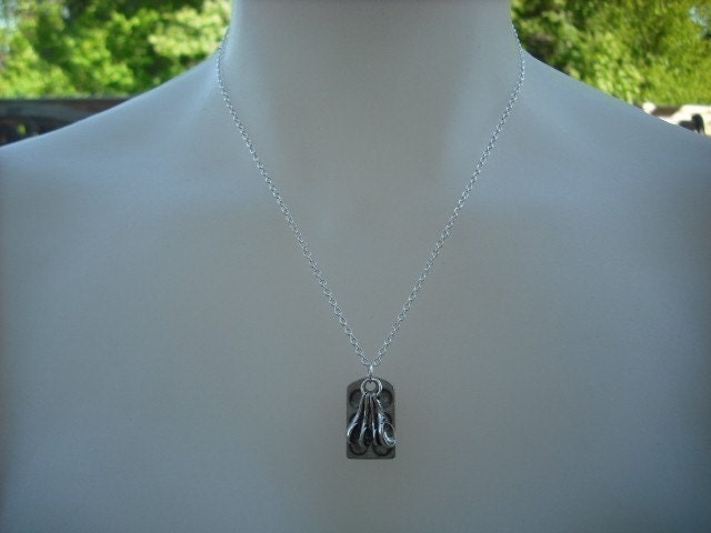 muffin pan and measuring spoon necklace