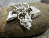 mothers day silver heart necklace with three funky artisan designs