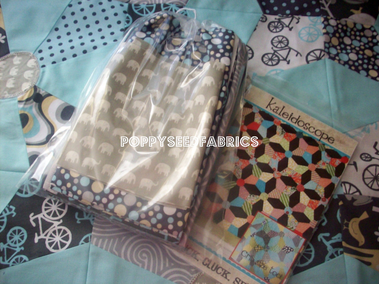 Last one..... Kaleidoscope Quilt Kit, in blues and grey's Crib size blanket, pattern from Cluck Cluck Sew