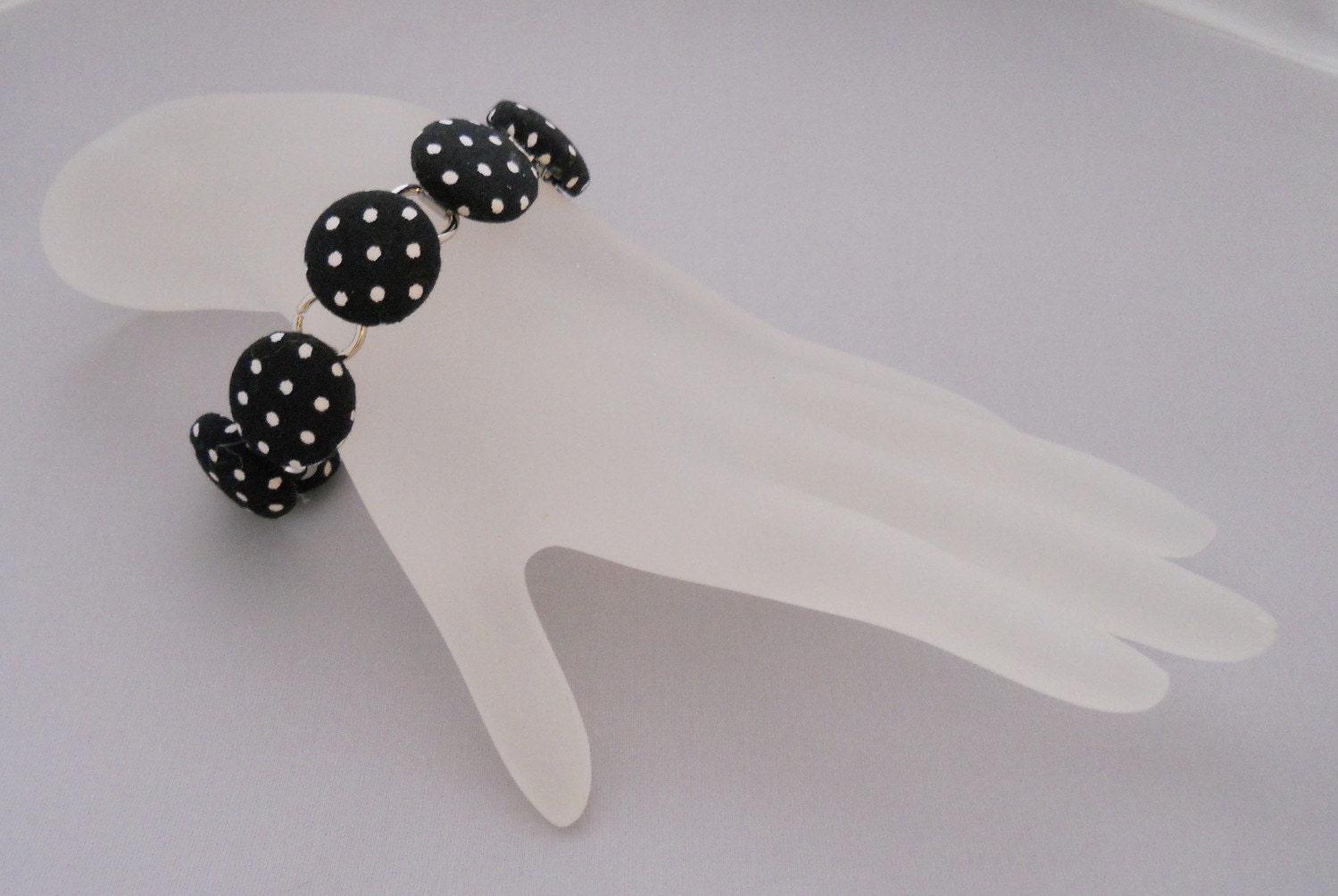 Black and White Polka Dot Bracelet from fabric covered buttons, handmade by JEJEWELED