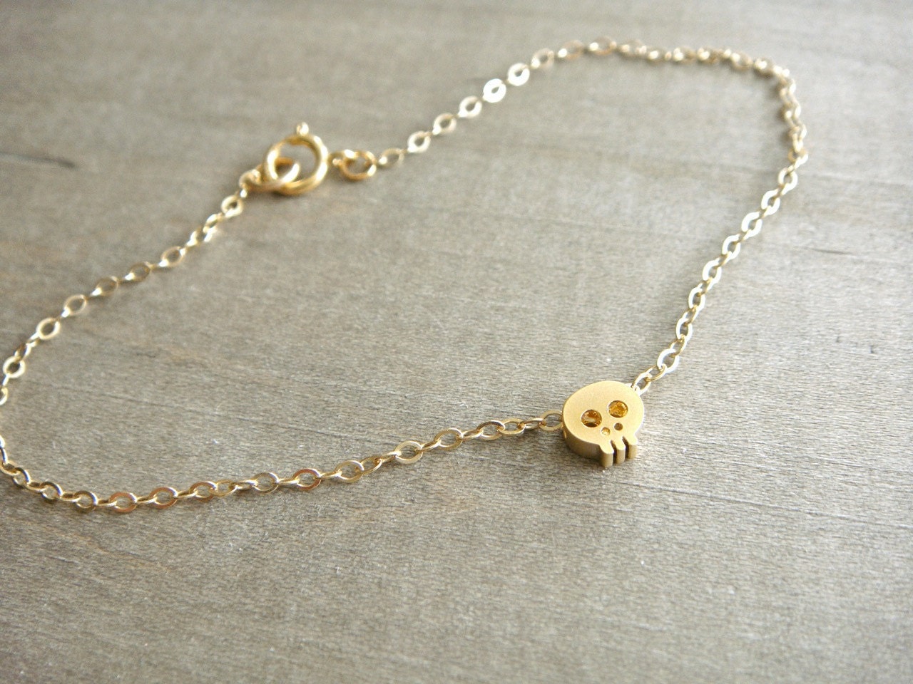 Tiny Skull Bracelet in Gold