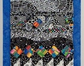 Bright Quilted Wall Hanging with Black and White