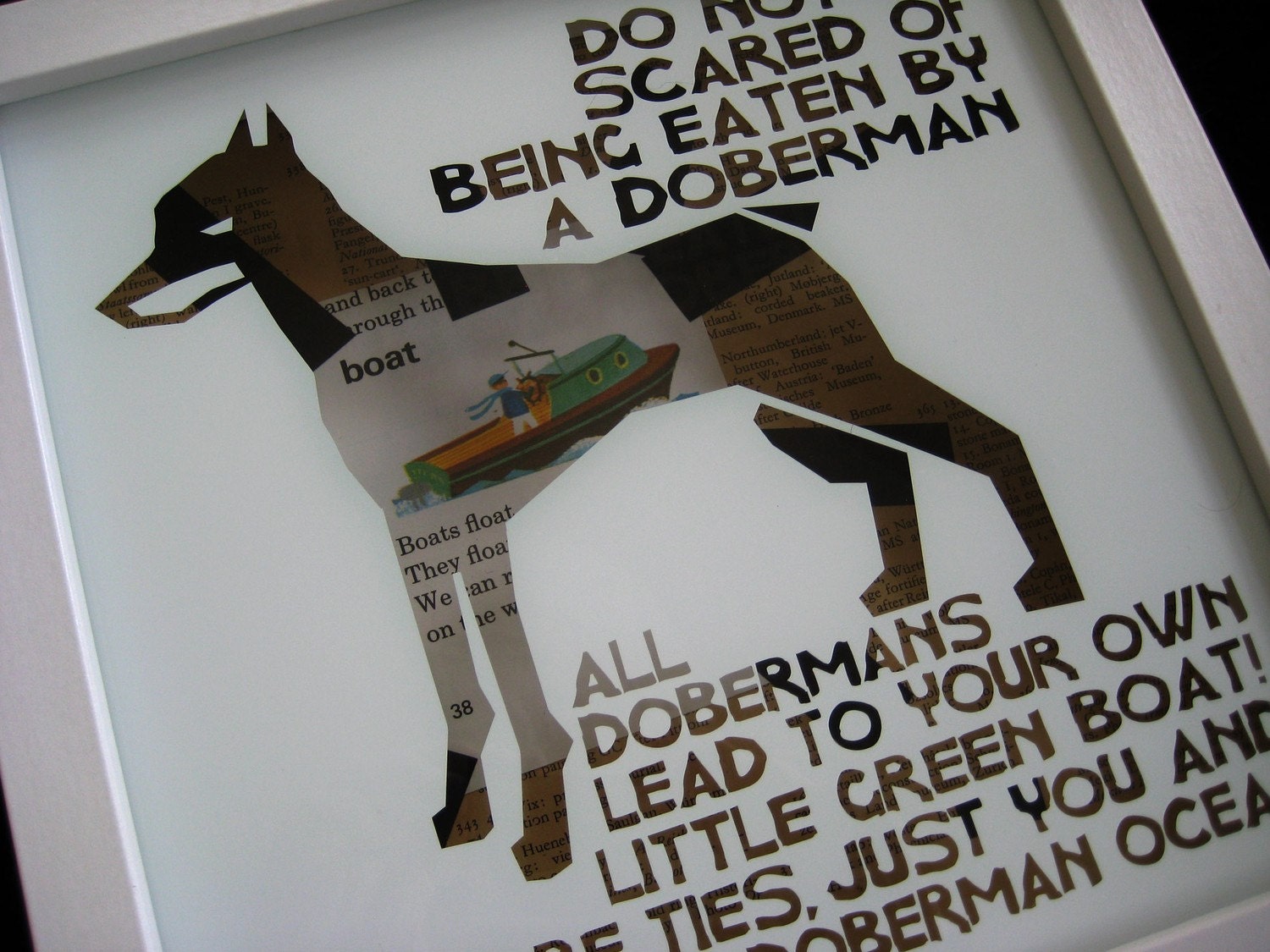 doberman have a little green boat inside.