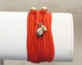 Silk Wrap Bracelet.  Bohemian summer wrap by m. frances.  Hand dyed in an Orange/Red with Gold Pyrite and 14K Goldfill Accents