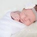 Crochet Baby Headband with Flower in White and Butter Cream on Grey Headband