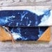 THE CONSTELLATION leather and canvas clutch