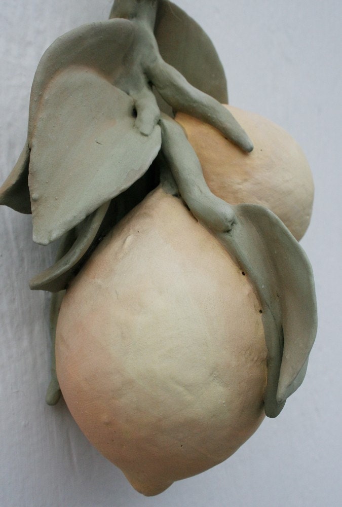 Sculpted ceramic branch with two lemons