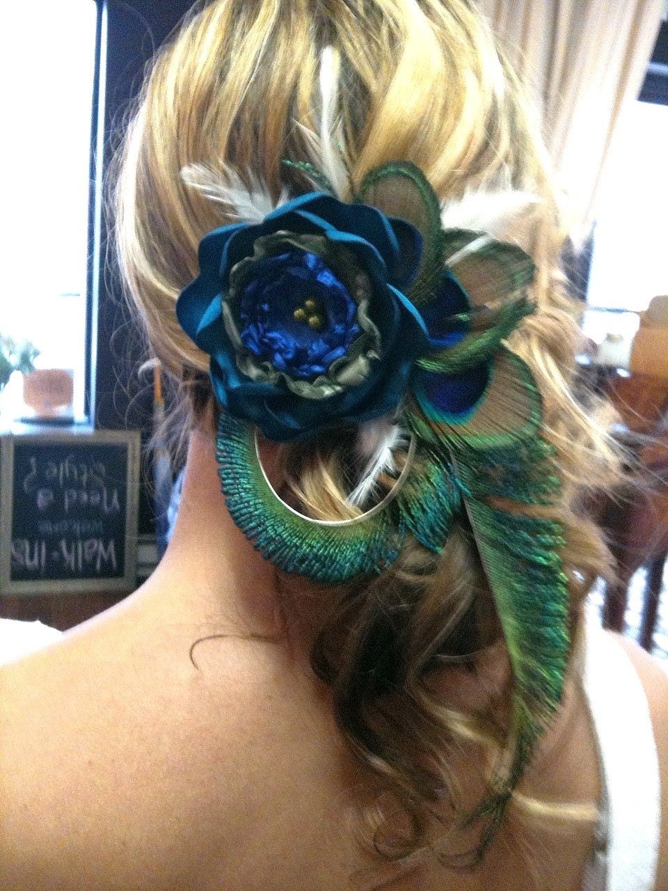 Beautiful Peacock hair clip with large flower.