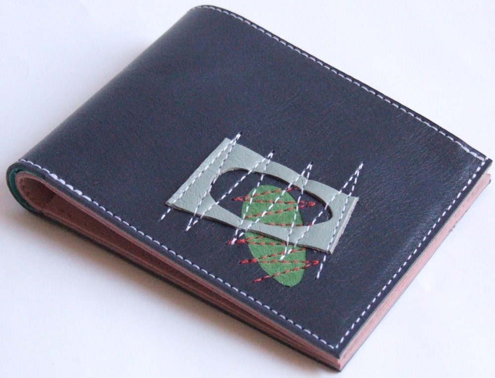 Navy leather wallet with mid-century detail, billfold style with pink inner