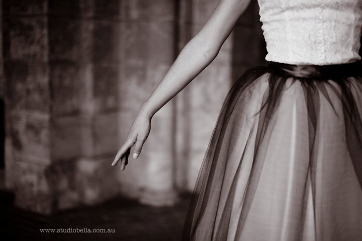 Classic black and ivory tulle tutu skirt for women. Lined in ivory satin in tea length.