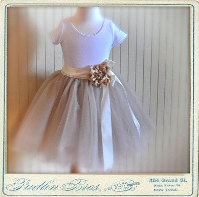 Champagne fluffy tutu with satin ribboned waist. Featured in Martha Stewart Weddings Magazine Spring 2011.