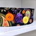 Boho Wrap Headband--neon brights in black, orange, purple, yellow paisleys with felt buttons.