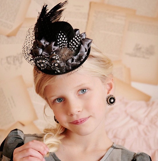 Rhinestone and a feathered mini top hat in black, silver and veiling. Edwardian, weddings, steampunk, costume, photo prop.