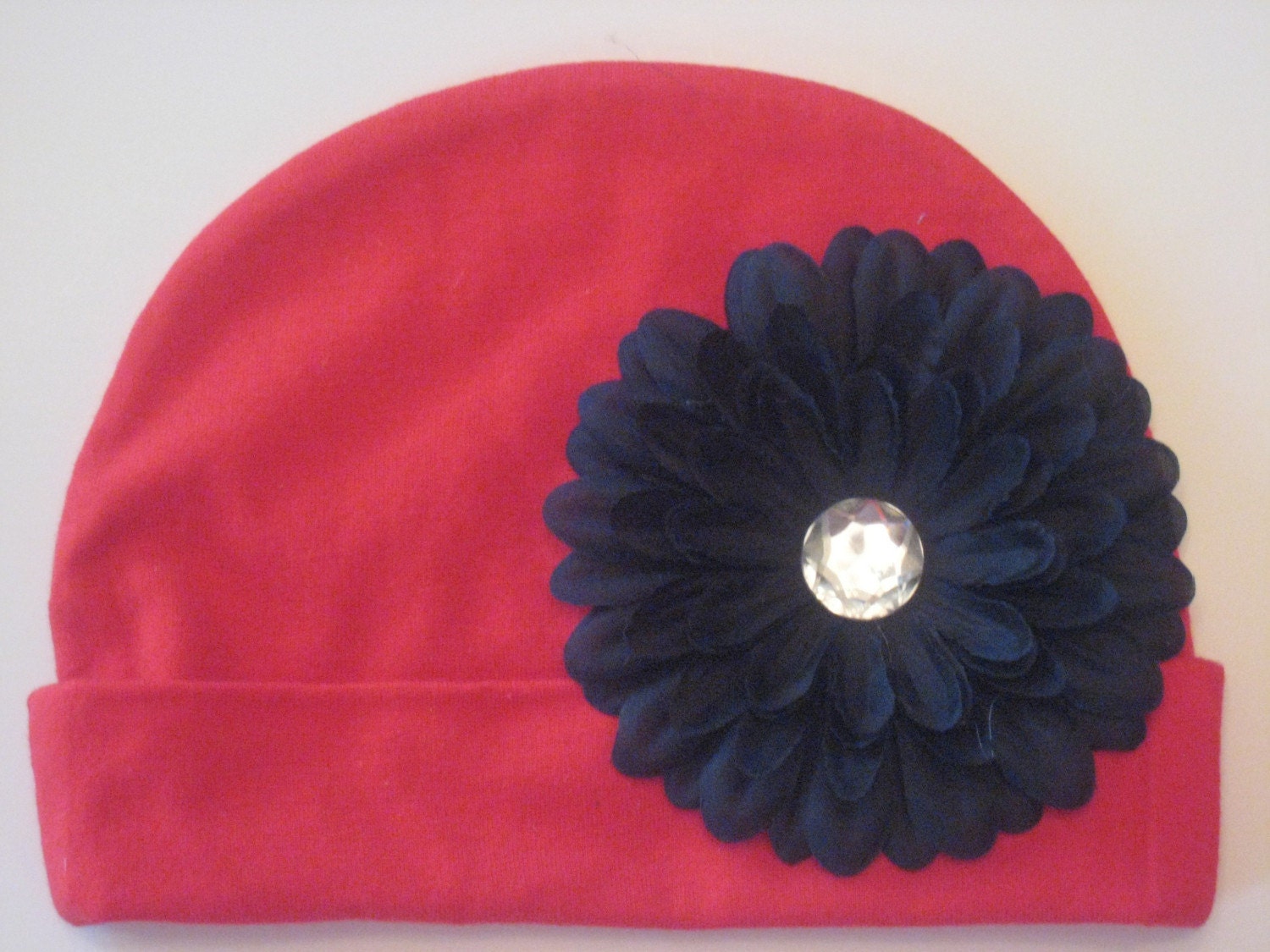 Husker Soft and Sassy Red Cotton Infant Hat with Adorable Black Flower