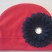 Husker Soft and Sassy Red Cotton Infant Hat with Adorable Black Flower