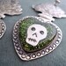 Iconic Mexican Silver Sacred Flaming Heart Earrings with Skulls, Green Glitter, and Resin - Corazon Sagrado
