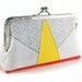 Clutch purse with yellow triangle