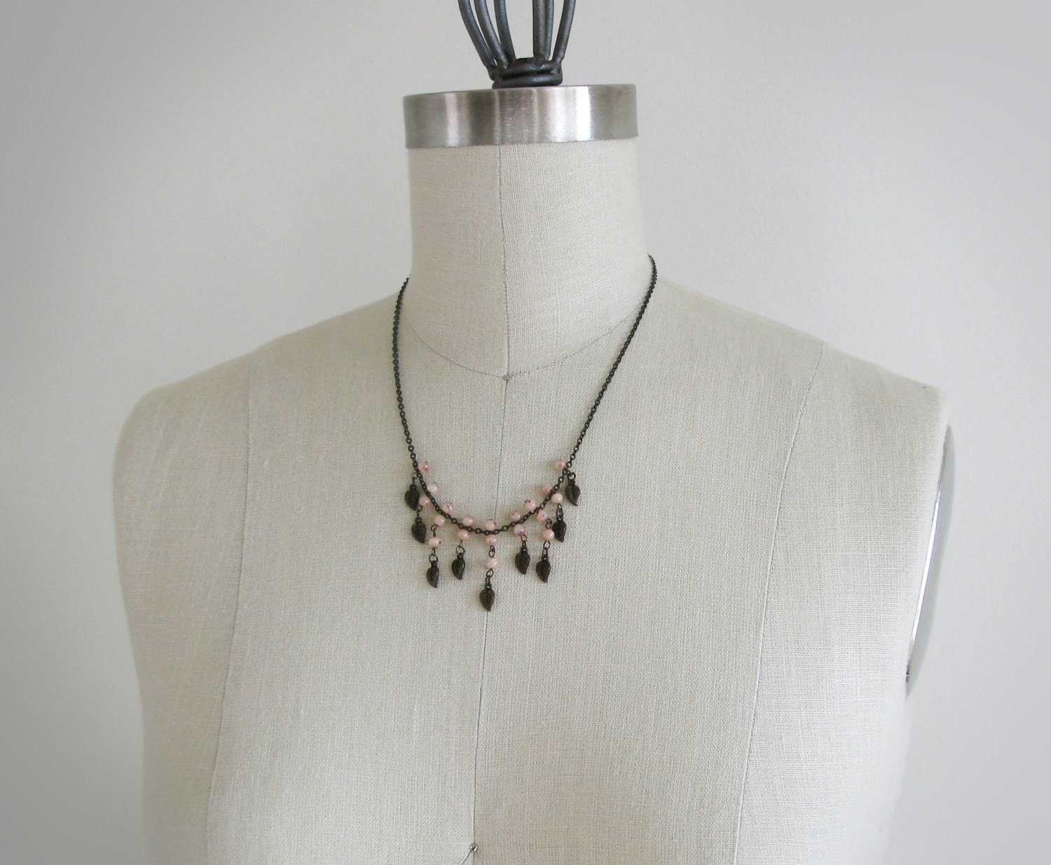Vintage brass necklace with pink beads.