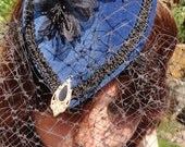 Indigo Sky blue velvet fascinator, steampunk inspired teardrop mini hat, with black veiling and gold detail.