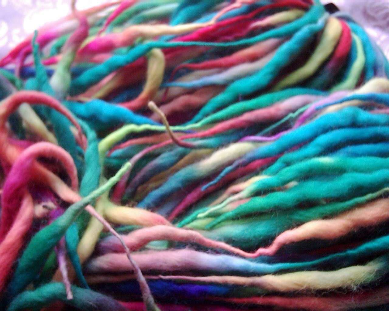 Tribal Falls Harlequin Desire, pink, orange, green and blue dreadlock pigtails