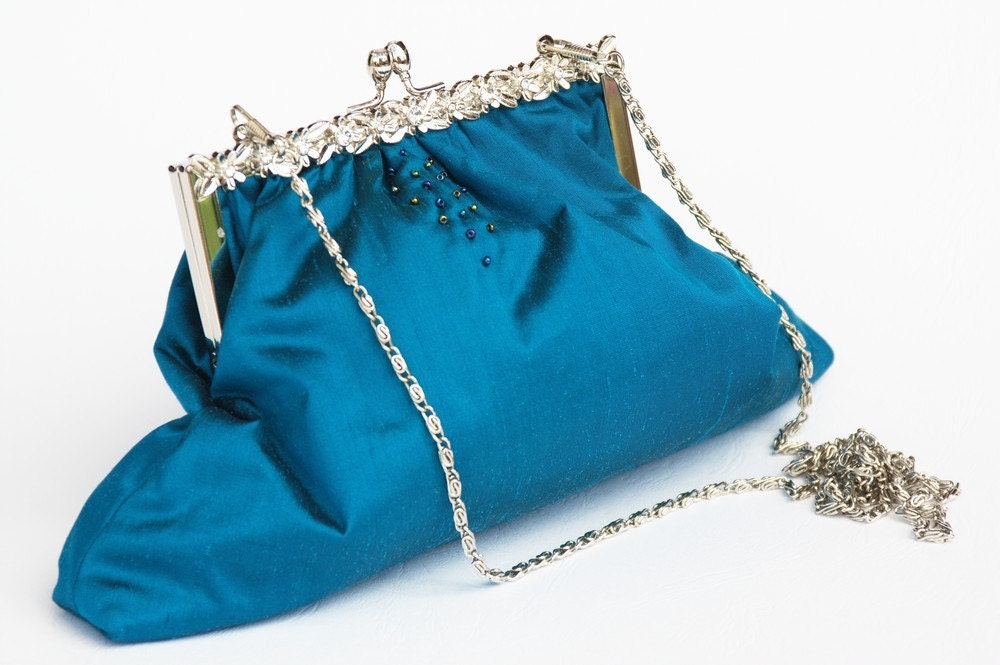 The stylish beaded silk turquoise framed Purse