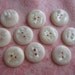 Vintage snow white iridescent slight dome flat back plastic buttons. Wholesale lot of 10.