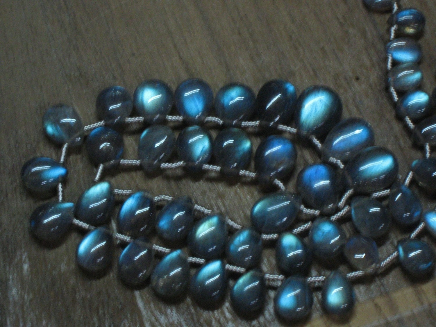 aaaa super high very nice quality gorgeous blue flashy fire labradorite smooth pear briolet size 3x5 mm to 5x7 mm - 65 pcs low price