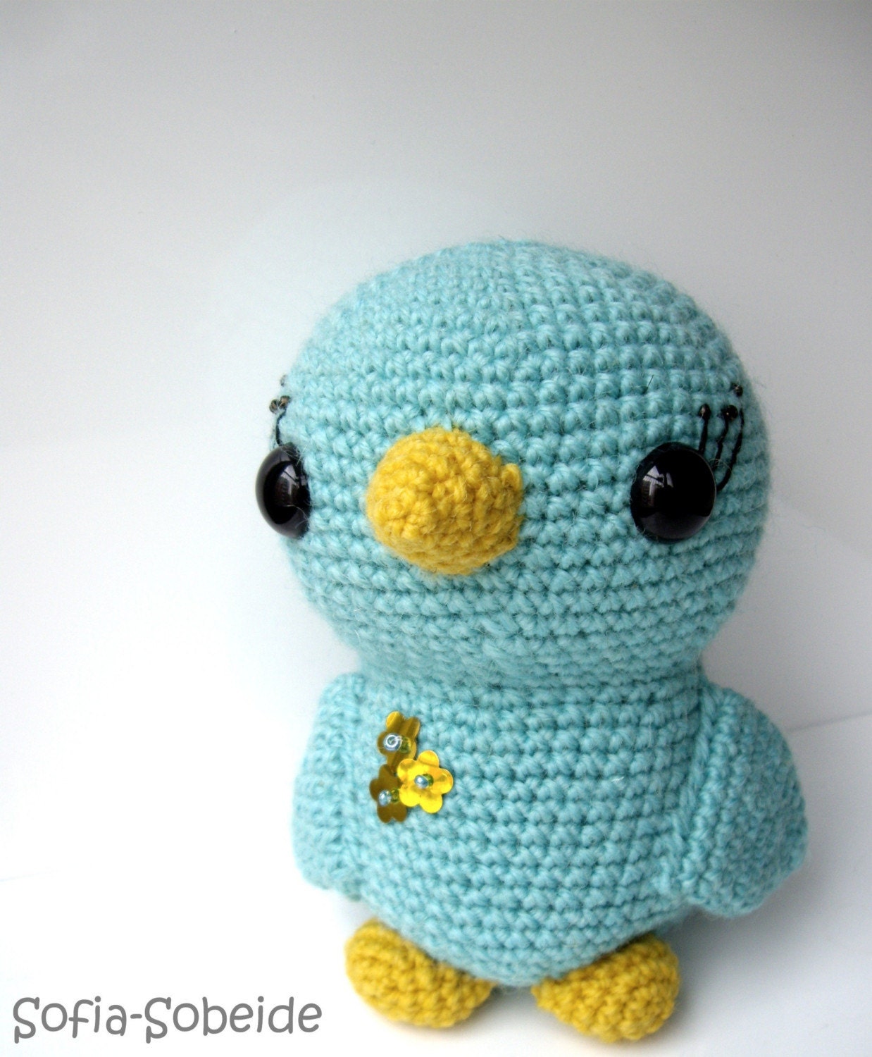 Turquoise crochet bird