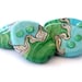 Handmade glass beads - 4 pressed Lampwork beads / pendants in turquoise, green and silvered ivory