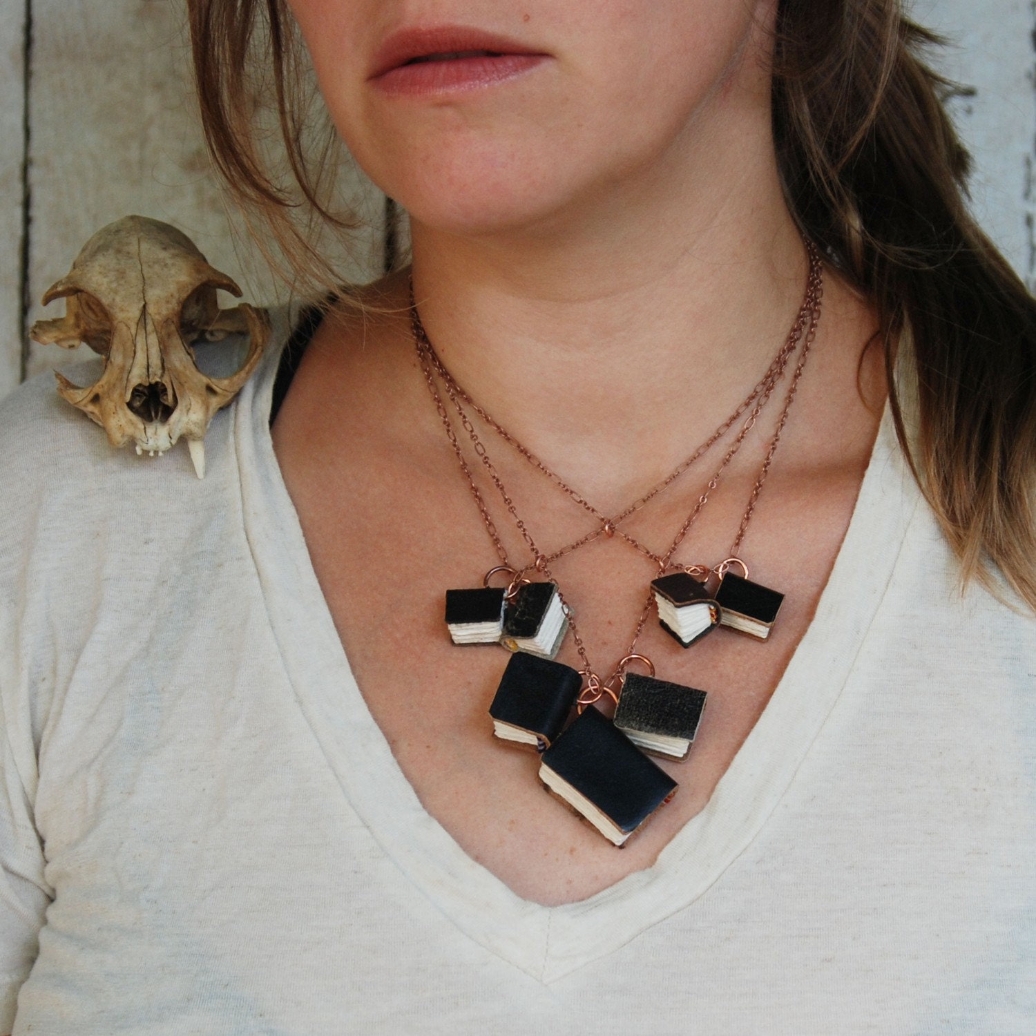 Darkended Library Book Necklace: 7 books of all sizes, black reclaimed leather.