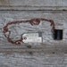 Book Necklace: Not Complicated, black leather with brown edge, small.