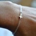 Tiny cross bracelet in Sterling silver